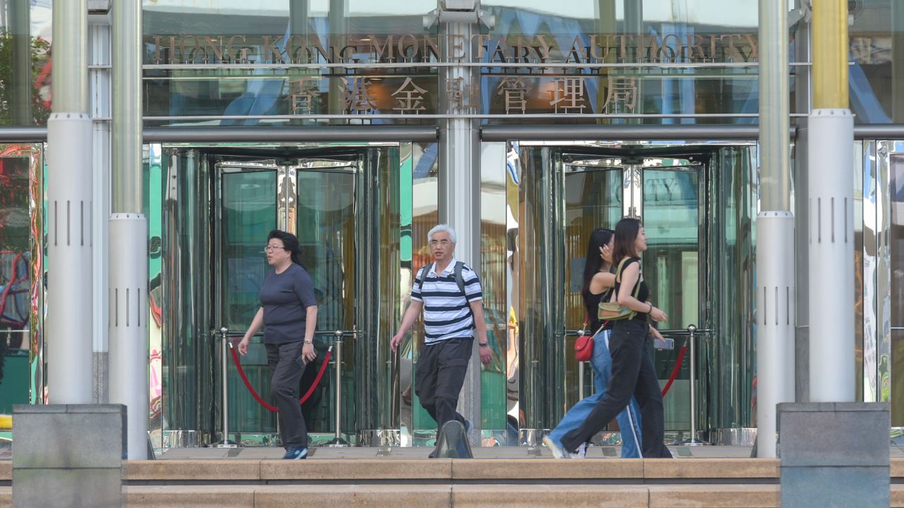 People walk past the Hong Kong Monetary Authority (HKMA) on May 4, 2023, in Hong Kong, China.