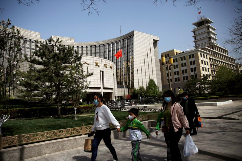 China cuts lending benchmark rate as economic recovery sputters