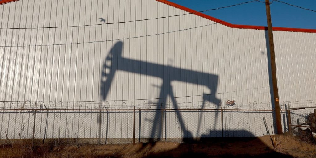 Oil futures settle at lowest since early July, pressured by demand worries and a rise in U.S. supplies