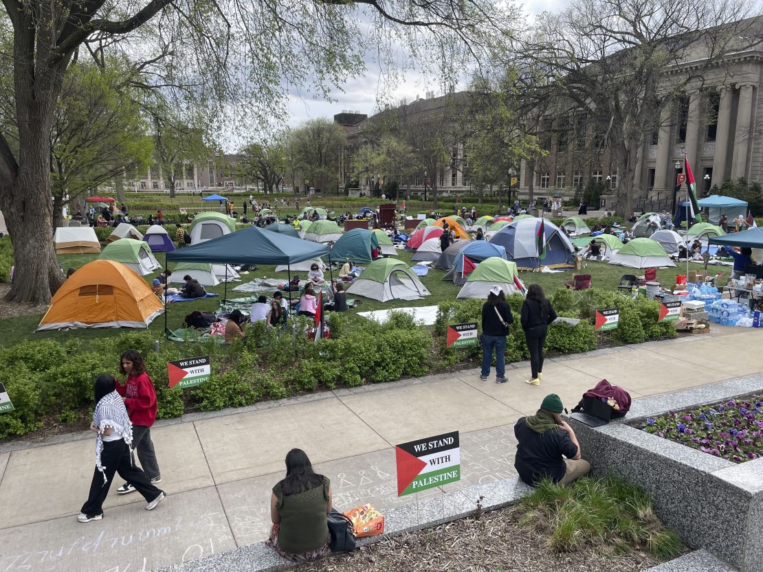 Dozens of tents and people are photographed on day two of an encampment in support of Palestinians at the University of Minnesota's campus in Minneapolis, Minn., on Tuesday, April 30, 2024.